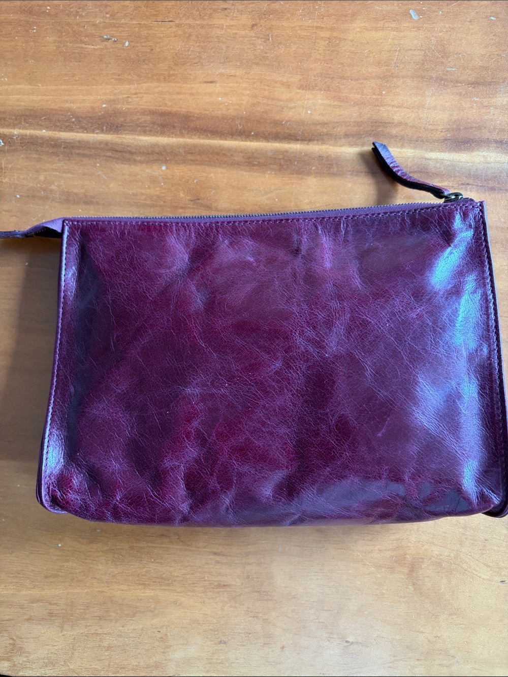 Eileen Fisher clutch, 100% leather exterior, nylon interior